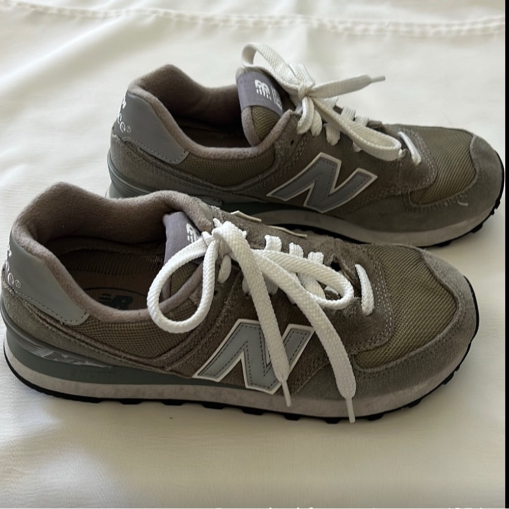Used Grey New Balance 574, women’s size 8.5. Almost great condition.